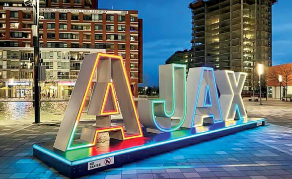 Ajax neon sign at night